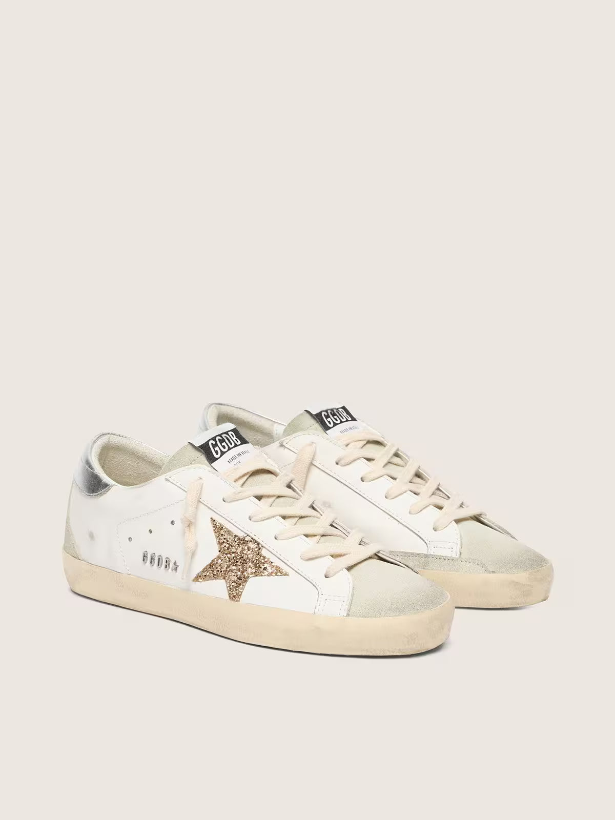 Golden Goose Super-Star, étoile paillettes dorées et empiècements daim gris froid